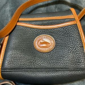 New Dooney & Bourke without tag. Small all leather crossbody bag.